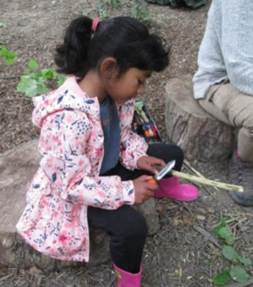 Child learning how to use tools